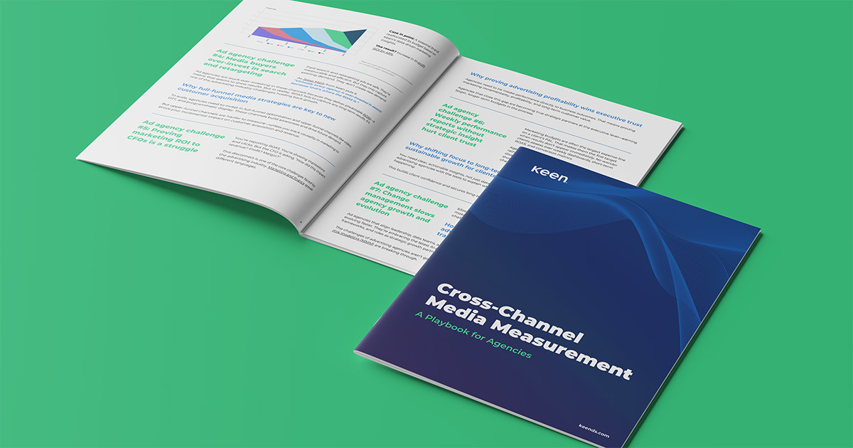 An open version of Keen's Cross-Channel Media Measurement Playbook for Agencies with a closed version laying on top.