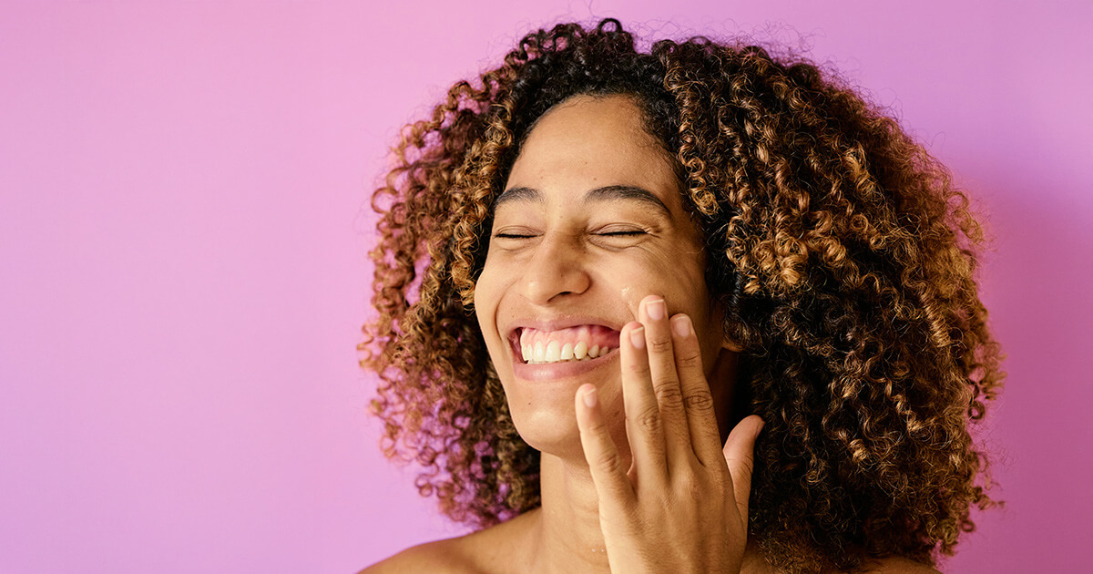 A woman applying a global beauty brand's product